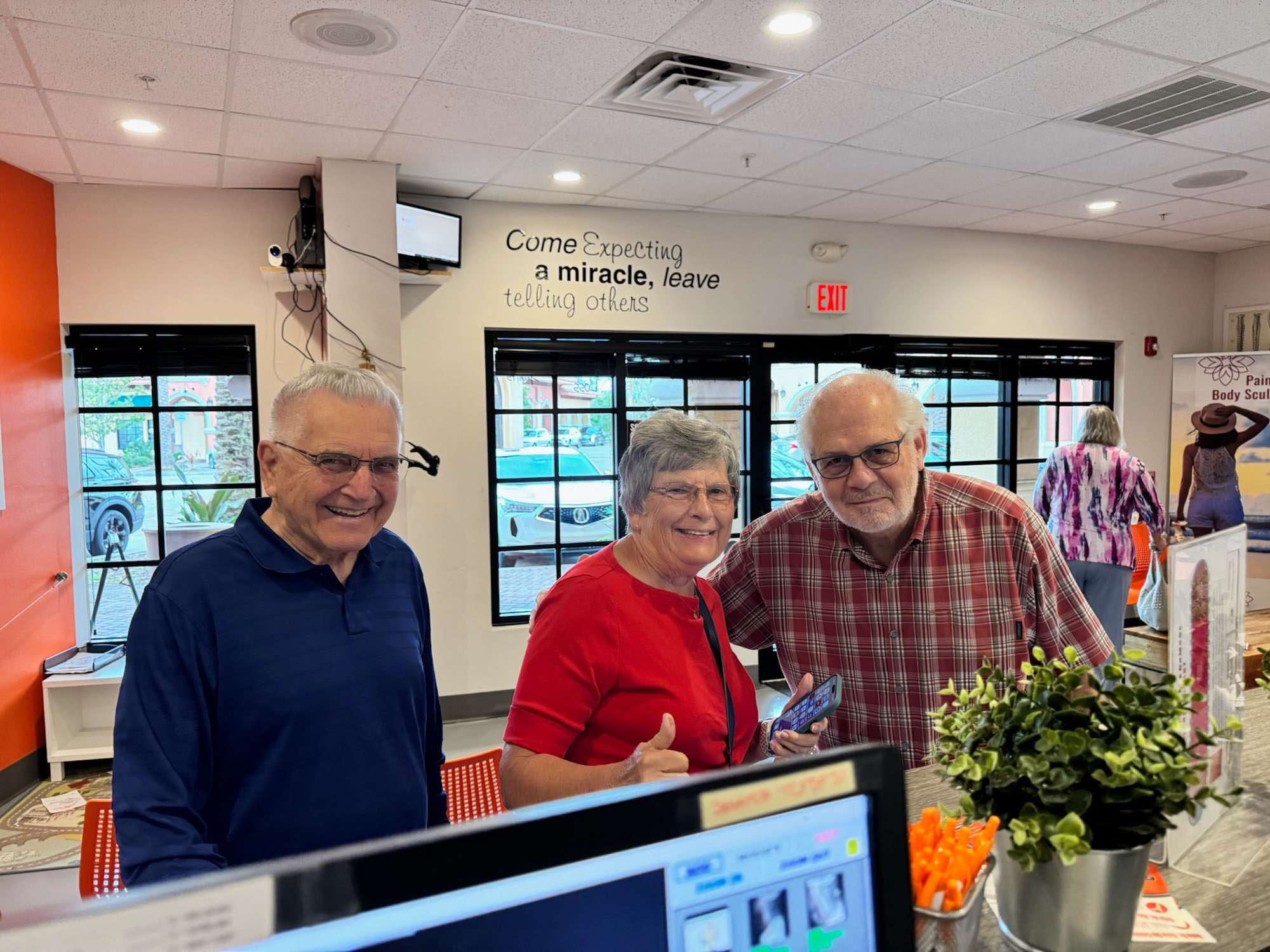 Senior patients smiling together after care at The Roots.